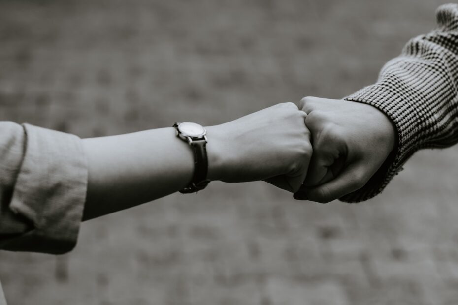 person wearing silver link bracelet watch