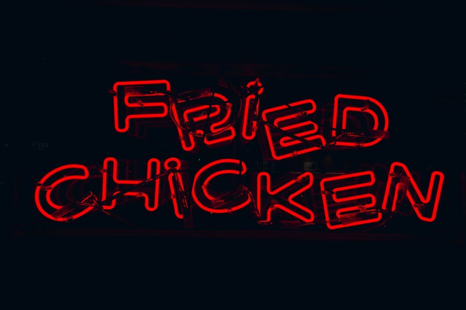 a neon sign that says fried chicken on it