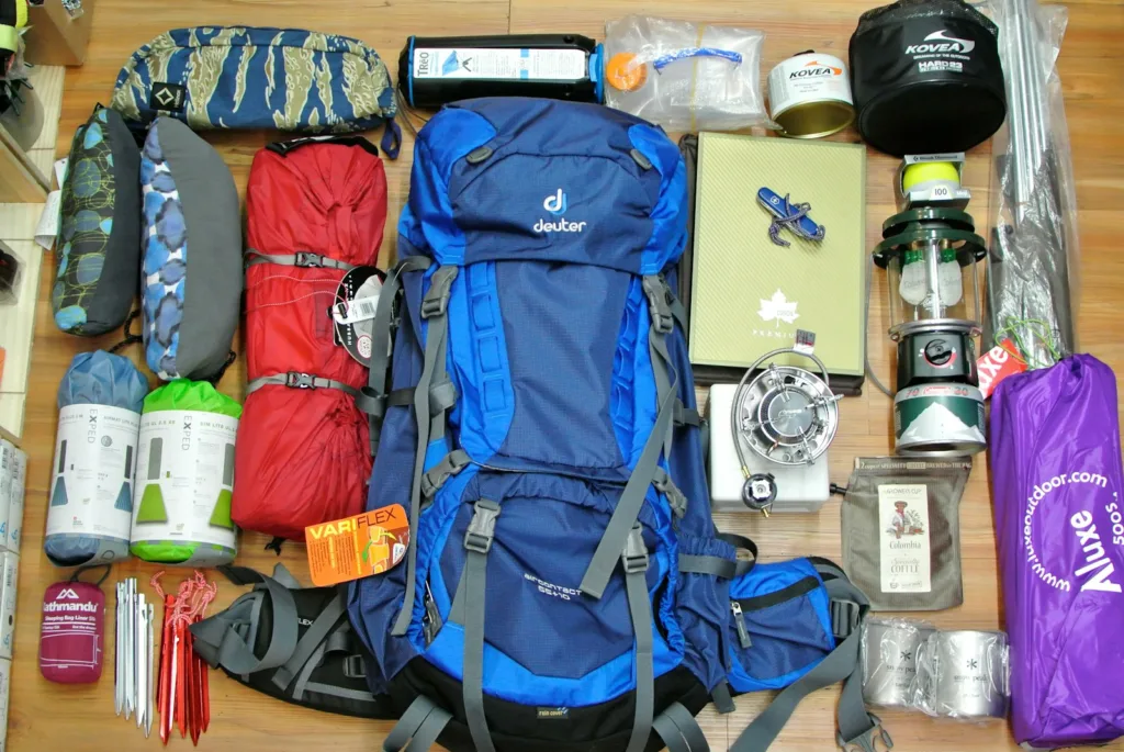 blue and black the north face backpack and a lot of other outdoor preparedness gear